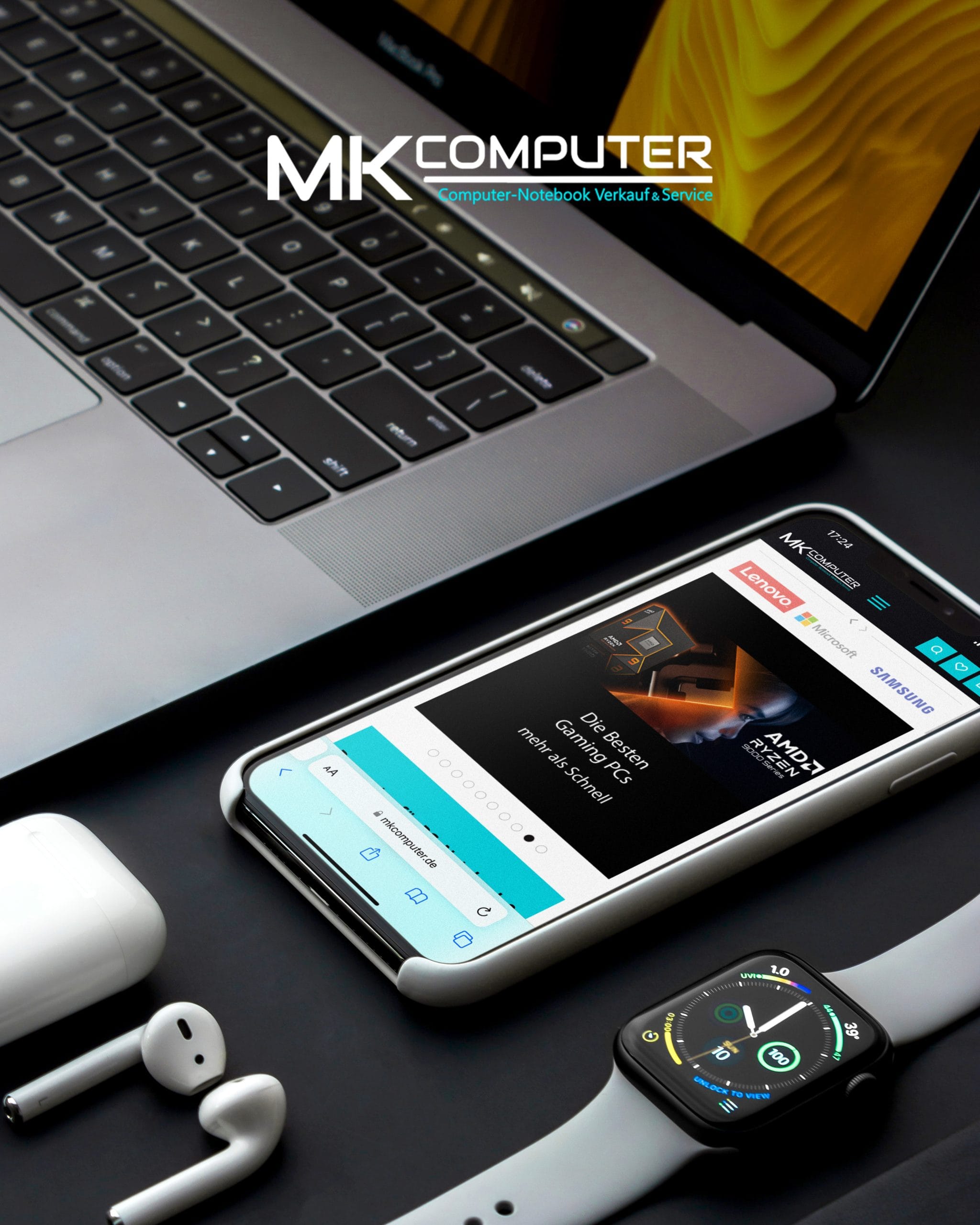 MKComputer promo visual — mkcomputer.de mobile store on a phone, laptop on desk